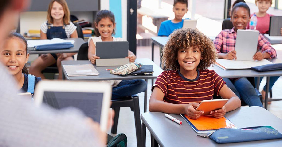IT company serving Florida schools and universities - smiling kids in classroom