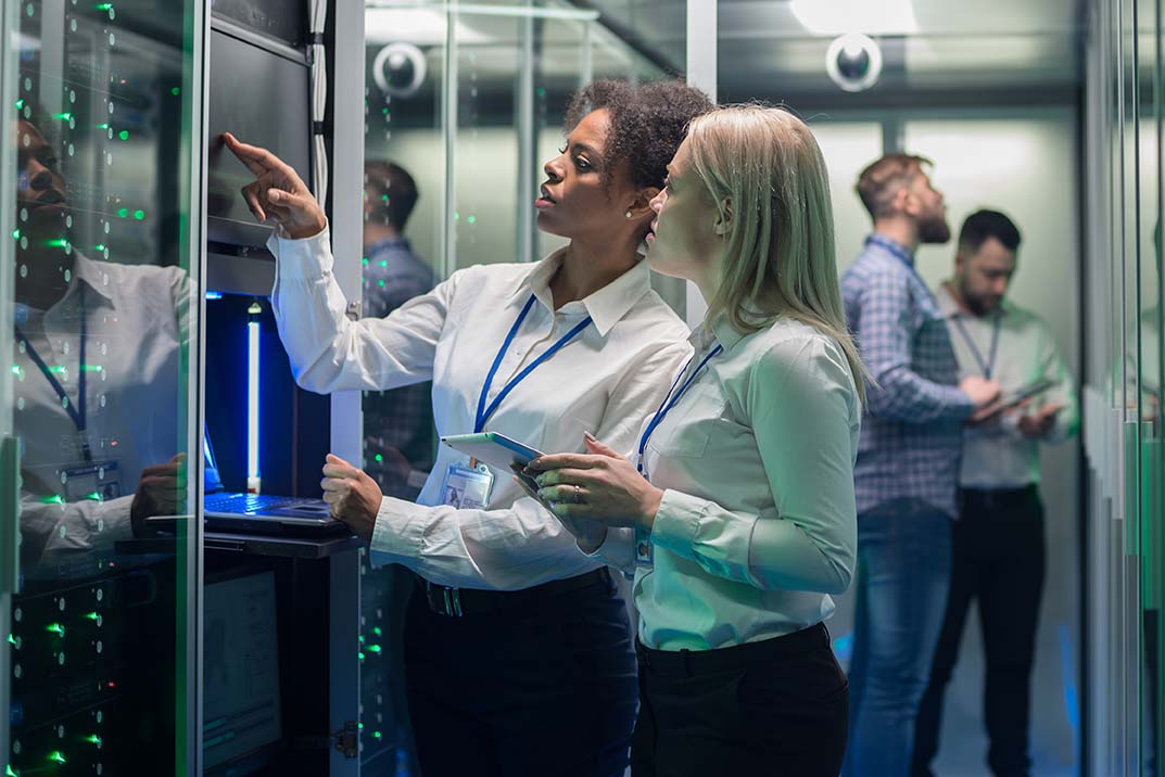 IT Services in Orlando - two women IT specialists examine servers