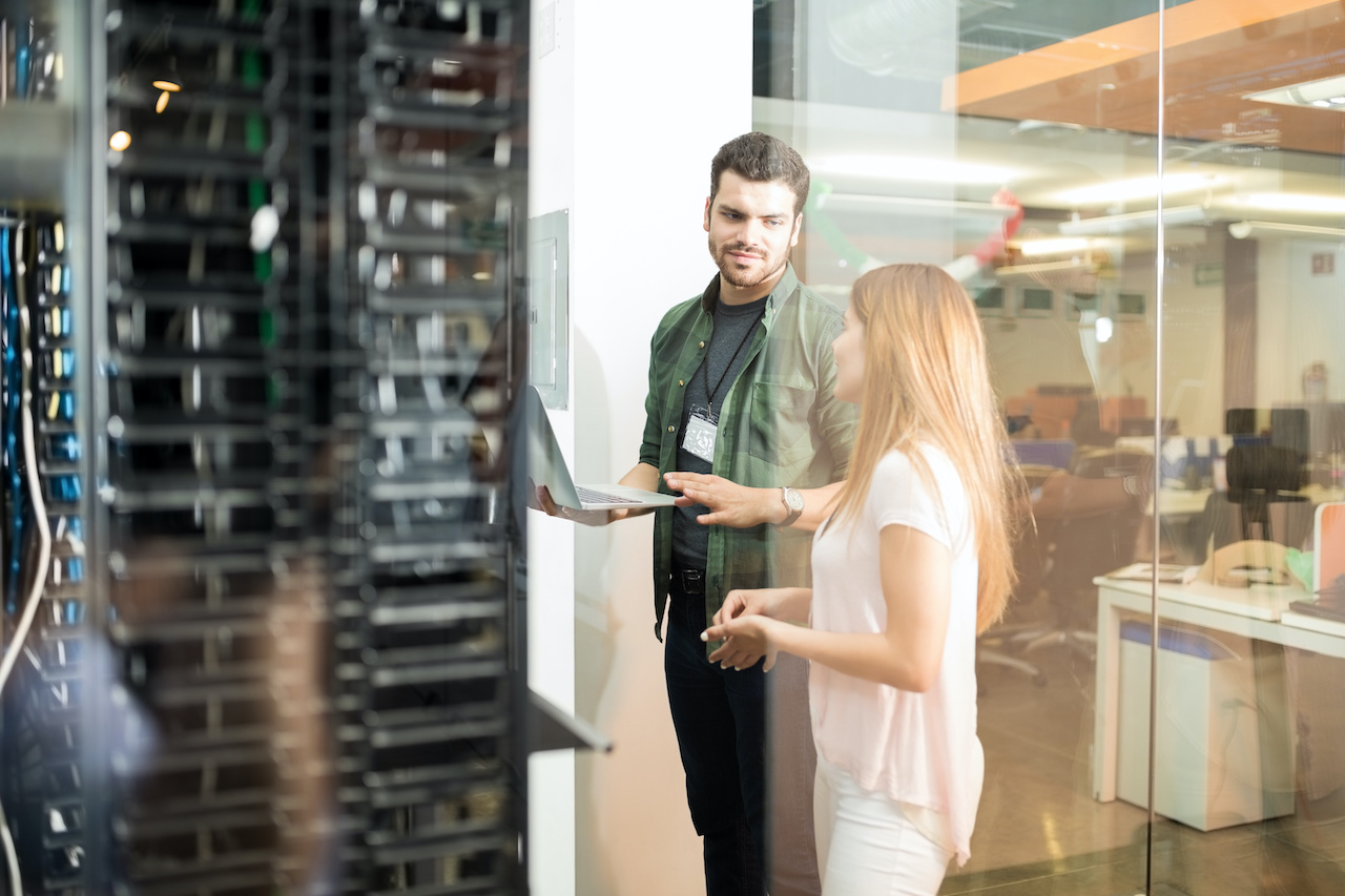 benefits of an MSP - two people talk in server room