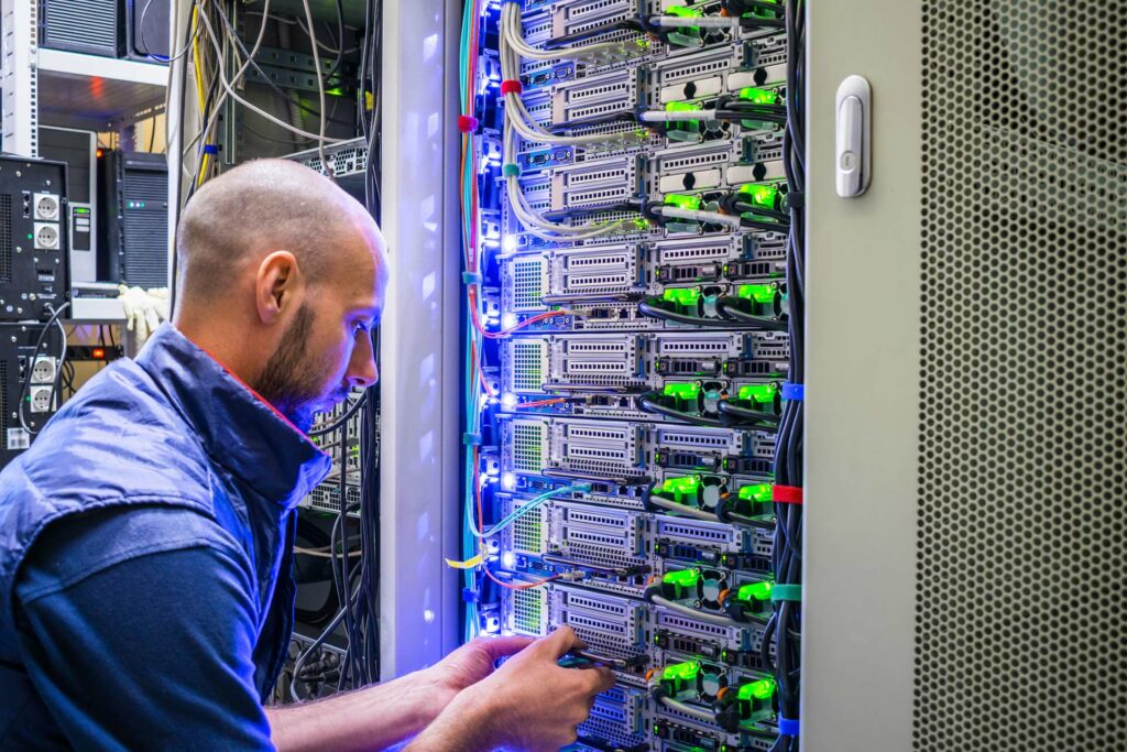 IT technician installing network cabling